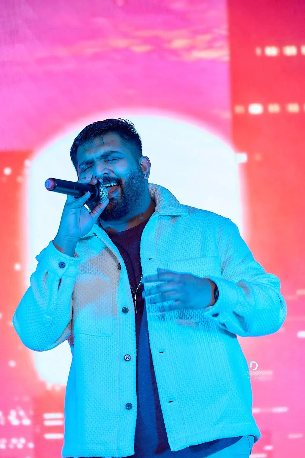 Fattymahn on stage with microphone